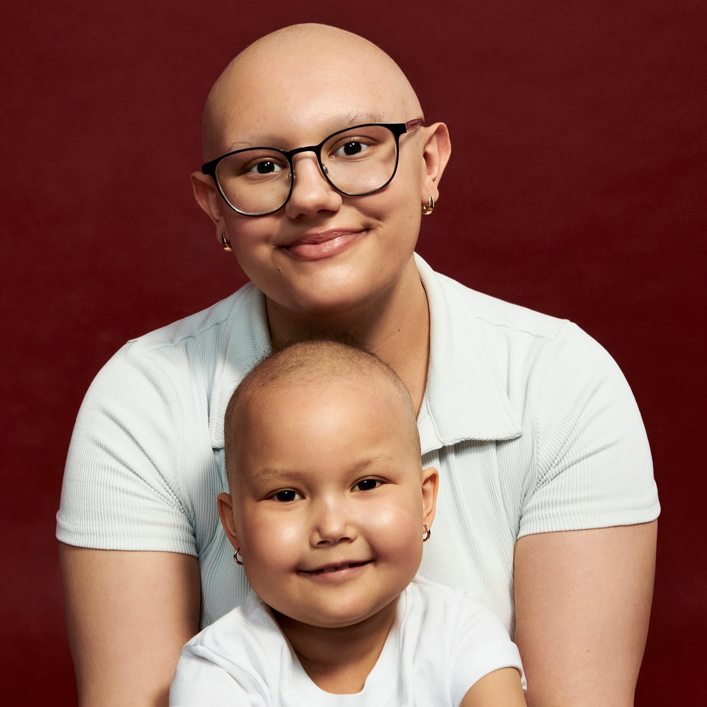 TWISTED LEUCAN HUGGIES EARRINGS.